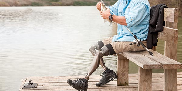 Man fishing with a prosthetic leg